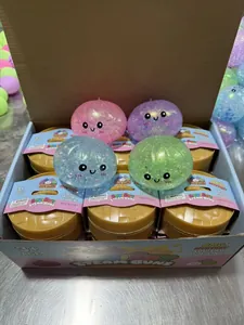 Glittery squishy steam bun stress toy in a mini steamer basket