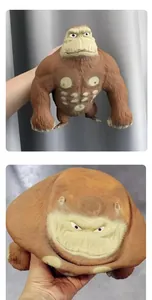 Squishy brown gorilla stress relief toy showing flexible decompression effect when squeezed.