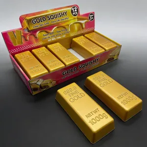 Detalle de juguetes blandos de lingotes de oro con grabado realista de oro 999.9