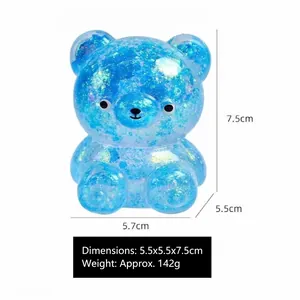 Gros plan d'un ours anti-stress bleu pailleté avec dimensions 5,5x5,5x7,5cm et poids 142g.