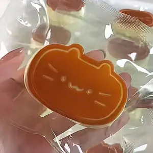 Close-up of a cute cat-shaped caramel pudding squeeze toy for effective stress relief