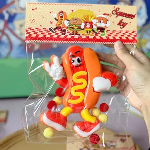 Detailed view of hot dog cartoon squeeze toy in transparent retail packaging for stress relief