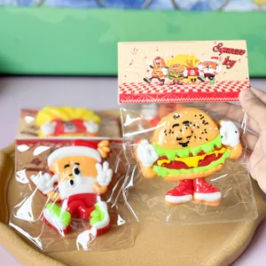 Detail view of hamburger and hotdog character squeeze toys in retail packaging