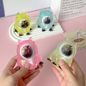 Hand-held glittery Capybara squishy toys in pink, green, blue, and yellow colors