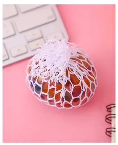 Detailed close-up view of a mesh grape stress ball filled with colorful water beads