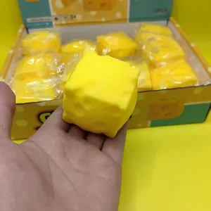 Close-up detail of a soft yellow square cheese squishy toy for slow rebound stress relief