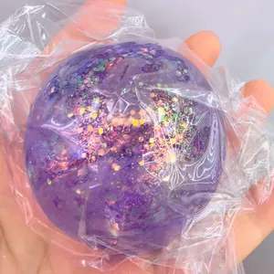 Macro view of a purple glitter stress ball with maltose texture in plastic wrap