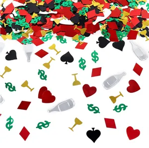 Close-up of Las Vegas themed PVC confetti with poker suits and dollar signs
