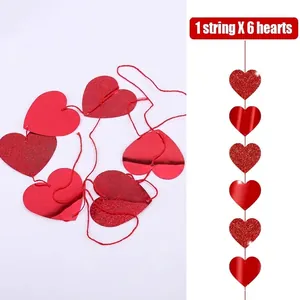 Close-up detail of a vibrant red laser heart garland string for Valentine's Day party decor