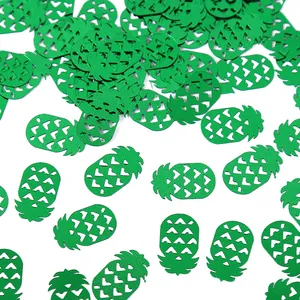 Vibrant green pineapple shaped confetti for Hawaiian beach theme party table decorations