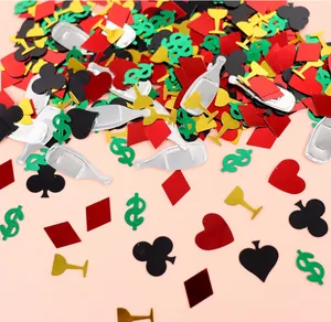 Close-up of poker-themed PVC confetti featuring card suits and dollar signs for party decor