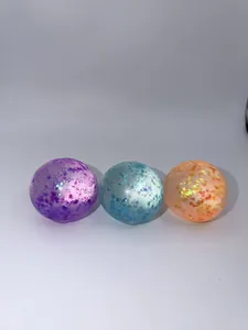 Close-up view showing three colorful sequin stress balls with a slow rebound texture.