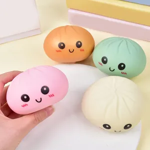 Set of four colorful cute baozi bun squishy toys with smiling faces for stress relief