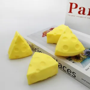 Realistic yellow cheese-shaped squishy toys for stress relief and sensory fidget play.