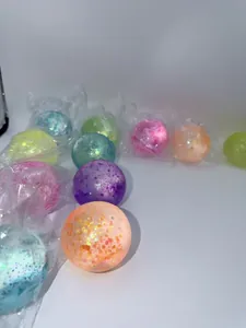 Close-up of colorful aurora glitter stress relief squeeze balls with slow rebound texture