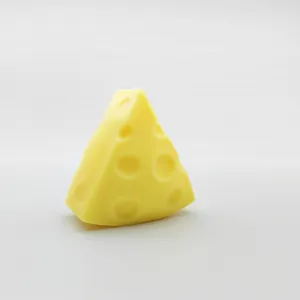 Close-up of yellow Swiss cheese squishy stress relief toy with realistic holes