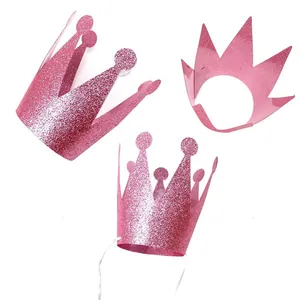 Detailed view of pink glitter party crowns with elastic bands for children's birthdays