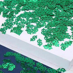 Close-up van groen metallic dollarteken PVC-confetti voor feesttafelversiering