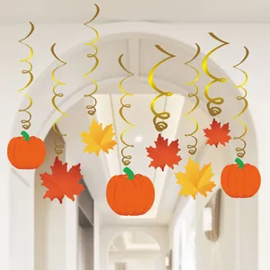 Close-up of Thanksgiving hanging swirls with pumpkin and maple leaf cutouts for party decor