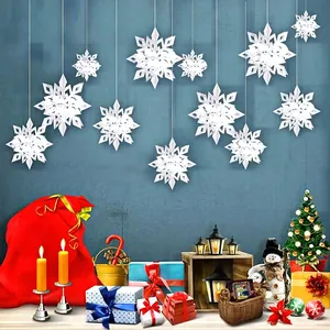 Decorative 3D white paper snowflake ornaments hanging in a festive Christmas scene