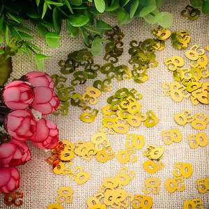 Shiny gold number 50 confetti table scatter for 50th birthday and anniversary party deco