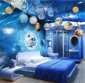 Galaxy themed ceiling swirls with planet cutouts for space party decor