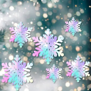 Close-up of 3D iridescent paper snowflake ornaments hanging in festive lighting