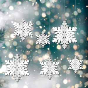Detailed view of 3D white paper snowflake hanging ornaments for festive Christmas decor