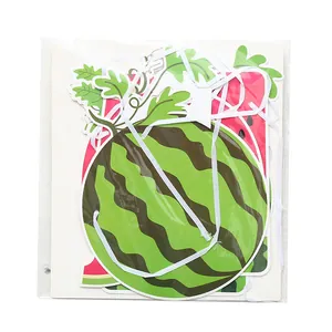 Detail view of the watermelon-themed birthday banner in its clear plastic packaging