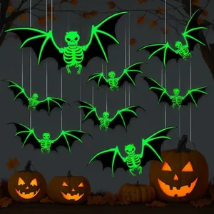 Detailed view of luminous green skeleton bat hanging decorations for Halloween party