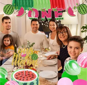 Family celebration with watermelon-themed birthday banners and one in a melon topper