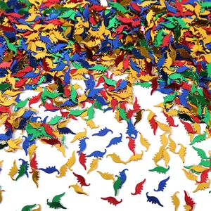 Detailed view of colorful metallic dinosaur confetti for Jurassic party decor