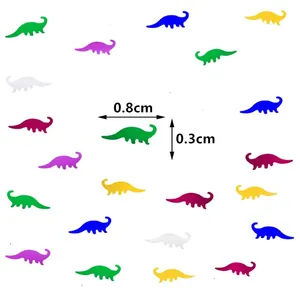 Macro view of colorful dinosaur party confetti with 0.8cm x 0.3cm dimensions shown
