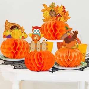 Detailed view of Autumn Thanksgiving honeycomb pumpkin decorations with owl and turkey toppers