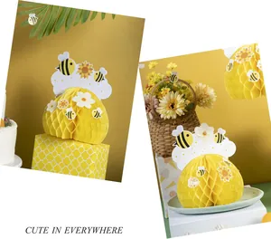 Detailed view of yellow bee honeycomb centerpieces for children's party decorations