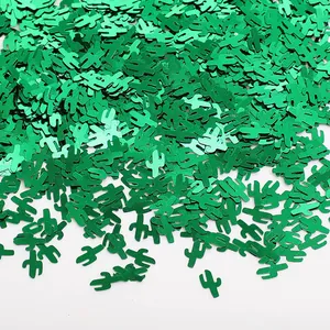 Macro view of metallic green cactus-shaped confetti for Mexican theme party décor