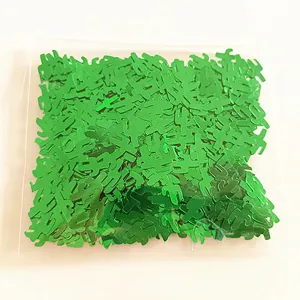 Detailed view showing green cactus-shaped PVC party confetti in transparent plastic bag