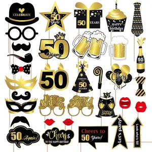 34-piece set of black and gold 50th birthday photo booth props with glitter accents