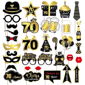 34-piece set of 70th birthday photo booth props in elegant black and gold theme