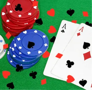 Detail of poker-themed PVC confetti with heart and spade shapes for Las Vegas party decor