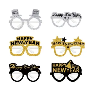 Detail showing six styles of glittery New Year party paper glasses in gold and silver
