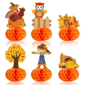 Variety of Thanksgiving honeycomb centerpieces with turkey and pumpkin motifs