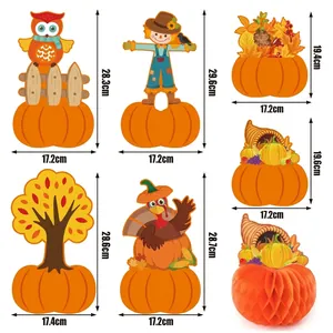 Detail showing various sizes and styles of Thanksgiving honeycomb paper table ornaments