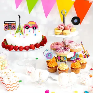 Vibrant 90s theme party scene with retro radio and guitar cake toppers on treats