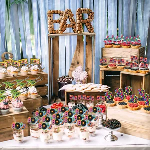 Vibrant 80s retro party cupcake toppers set displayed on a festive dessert table setup.