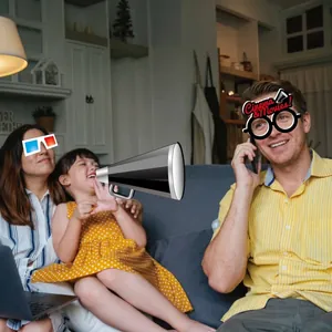 Joyful family posing with Hollywood movie theme photo booth props for a fun home party