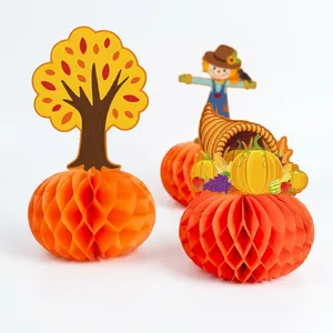 Thanksgiving honeycomb paper table centerpieces with pumpkin, scarecrow and autumn tree