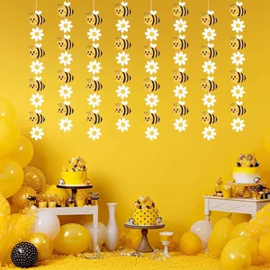 Detail view of cute bee and daisy flower garland for birthday party decor