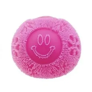Macro view of pink textured squeeze toy featuring a minimalist smiley face design