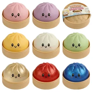 Set di 9 squishy dumpling colorati con faccina sorridente e mini cestelli per lo stress.